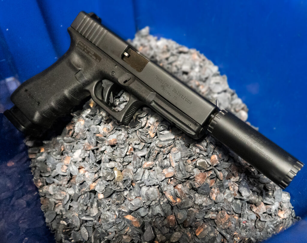Image of the TSG-22 M19/23 Maintenance Kit for GLOCK® Conversions against shell casings.