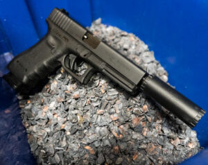 Image of the TSG-22 M19/23 Maintenance Kit for GLOCK® Conversions against shell casings.