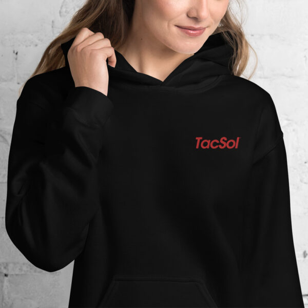 Women wearing a black hoodie that says "TacSol" in red.